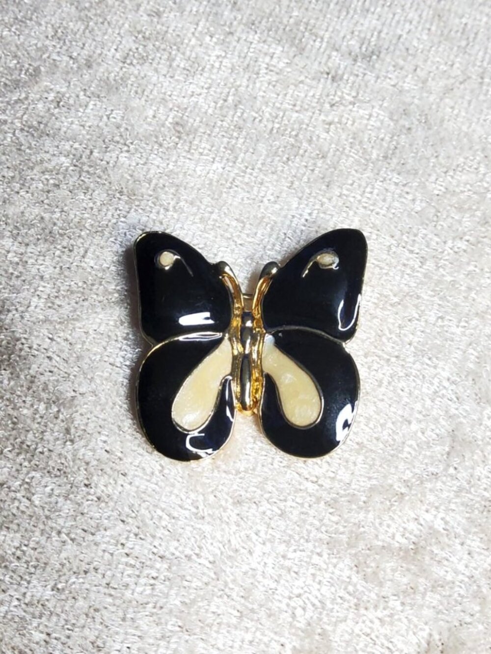 vintage gold tone, black and white enamel butterfly brooch